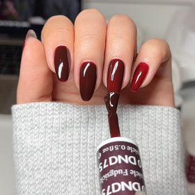 Nails styled with Fudgsicle color on natural nails for a chic finish