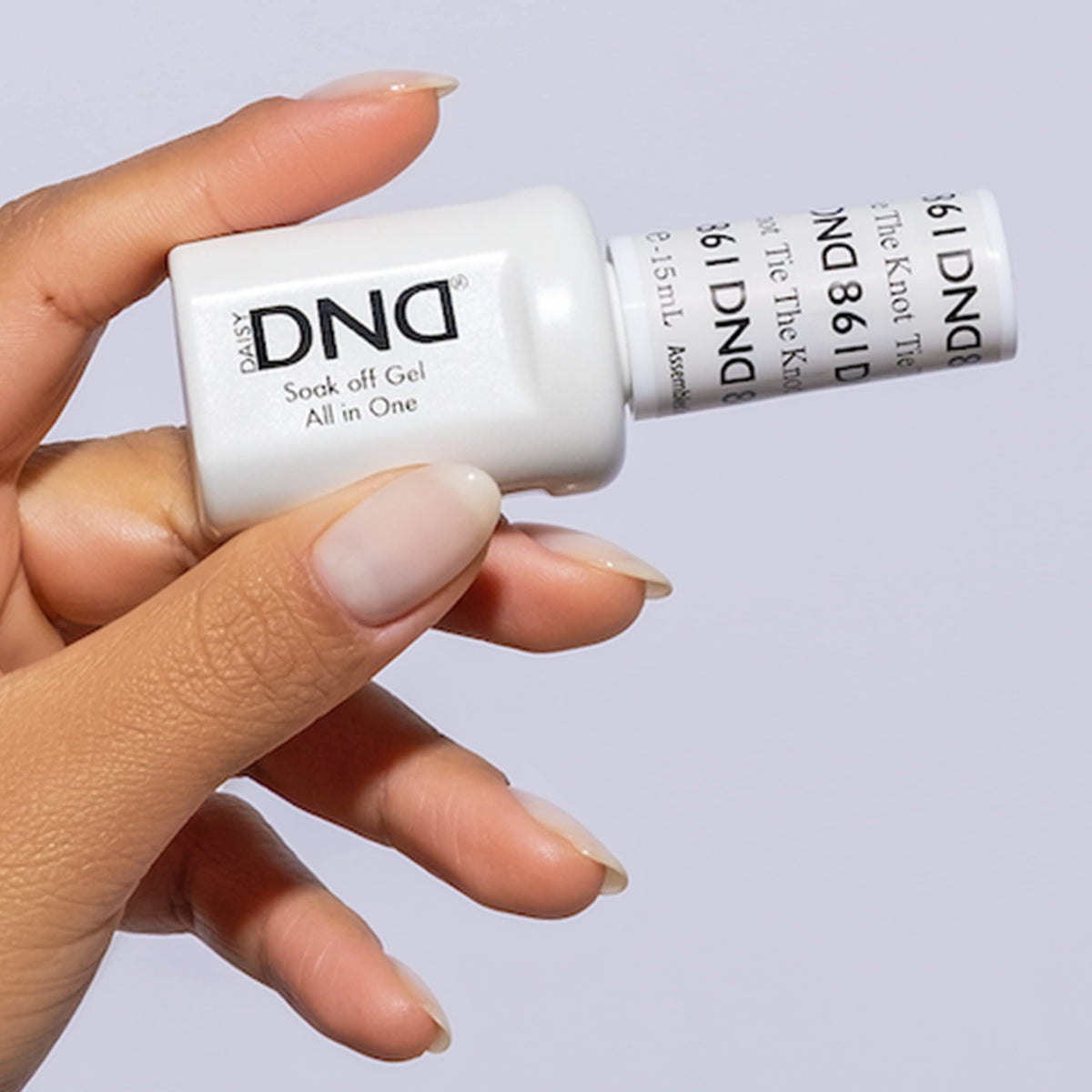 DAISY DND Tie The Knot lacquer bottle matches the gel for a cohesive look.