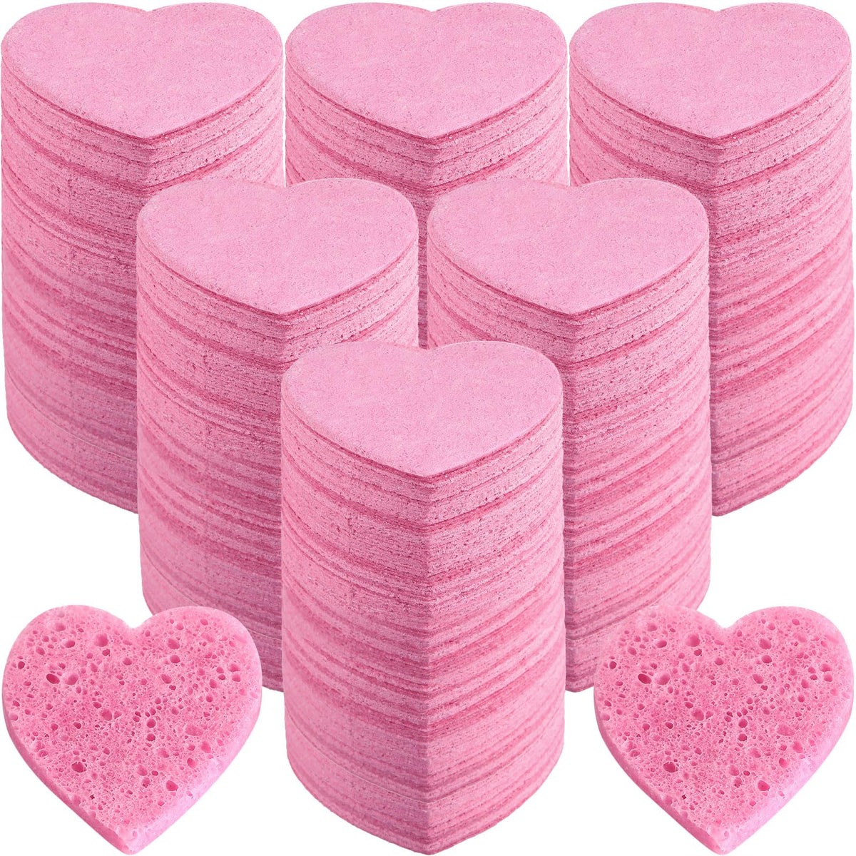 Dandat heart-shaped pink facial sponge for gentle cleansing and light exfoliation.