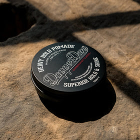 Dapper Dan Heavy Hold Pomade jar top view highlighting petrolatum-free formula for clean styling