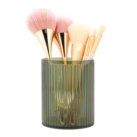 DASITON makeup brush holder in acrylic green with vintage stripes keeps brushes visible and within reach.