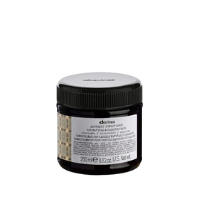Davines Alchemic Chocolate conditioner bottle closeup for brunette color depth and hydration.