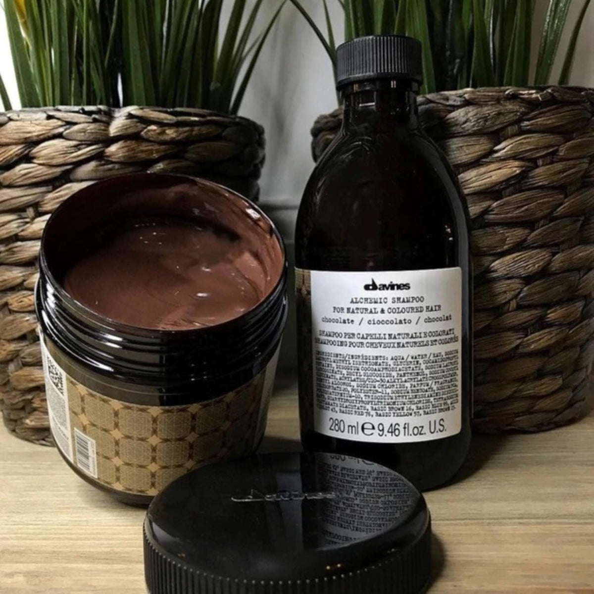 Davines Alchemic Chocolate conditioner jar front highlighting chocolate shade deposit.