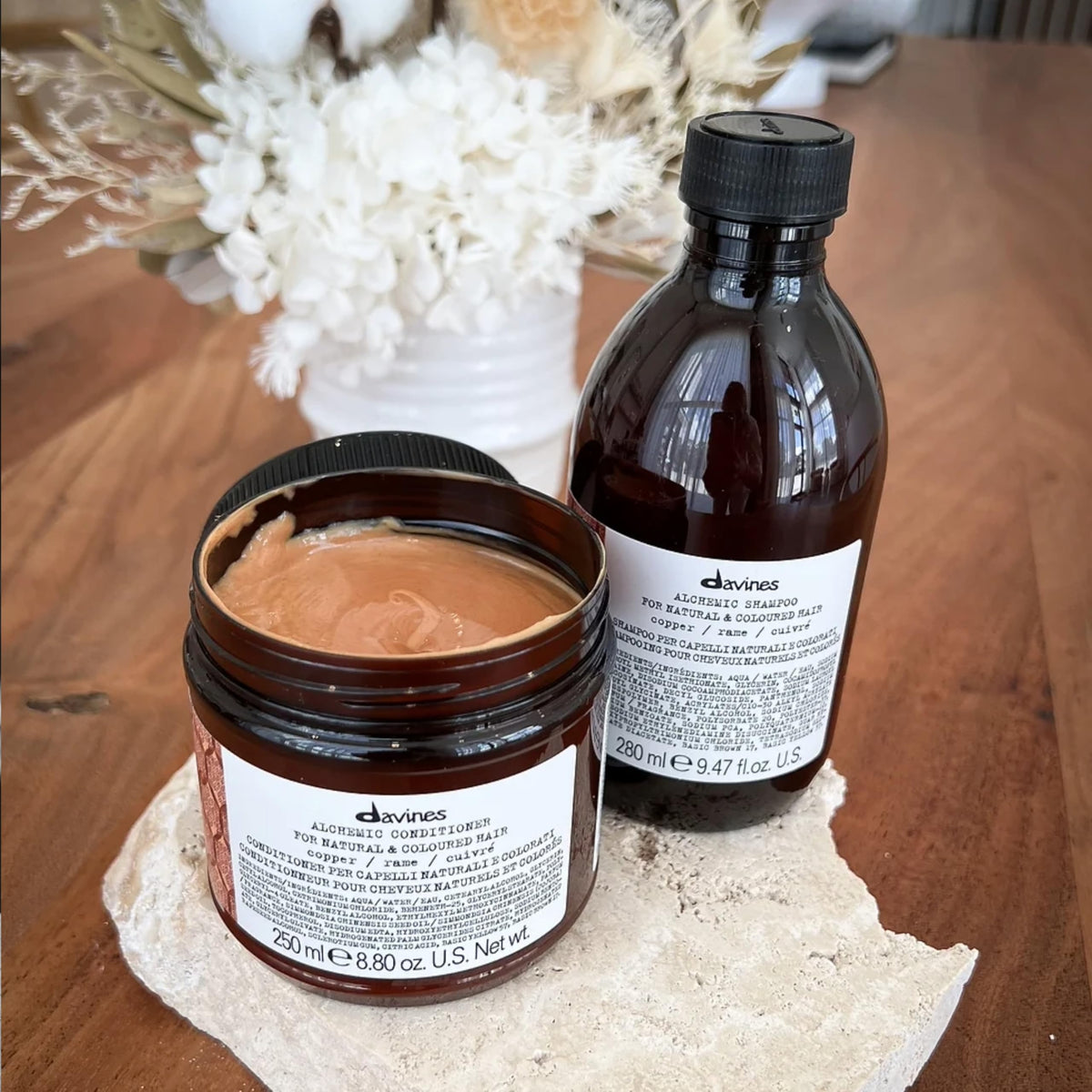 Davines Alchemic Copper conditioner on shelf display signaling premium color care
