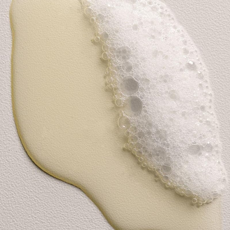 Davines DEDE bottle highlighting red celery extract in the formula.