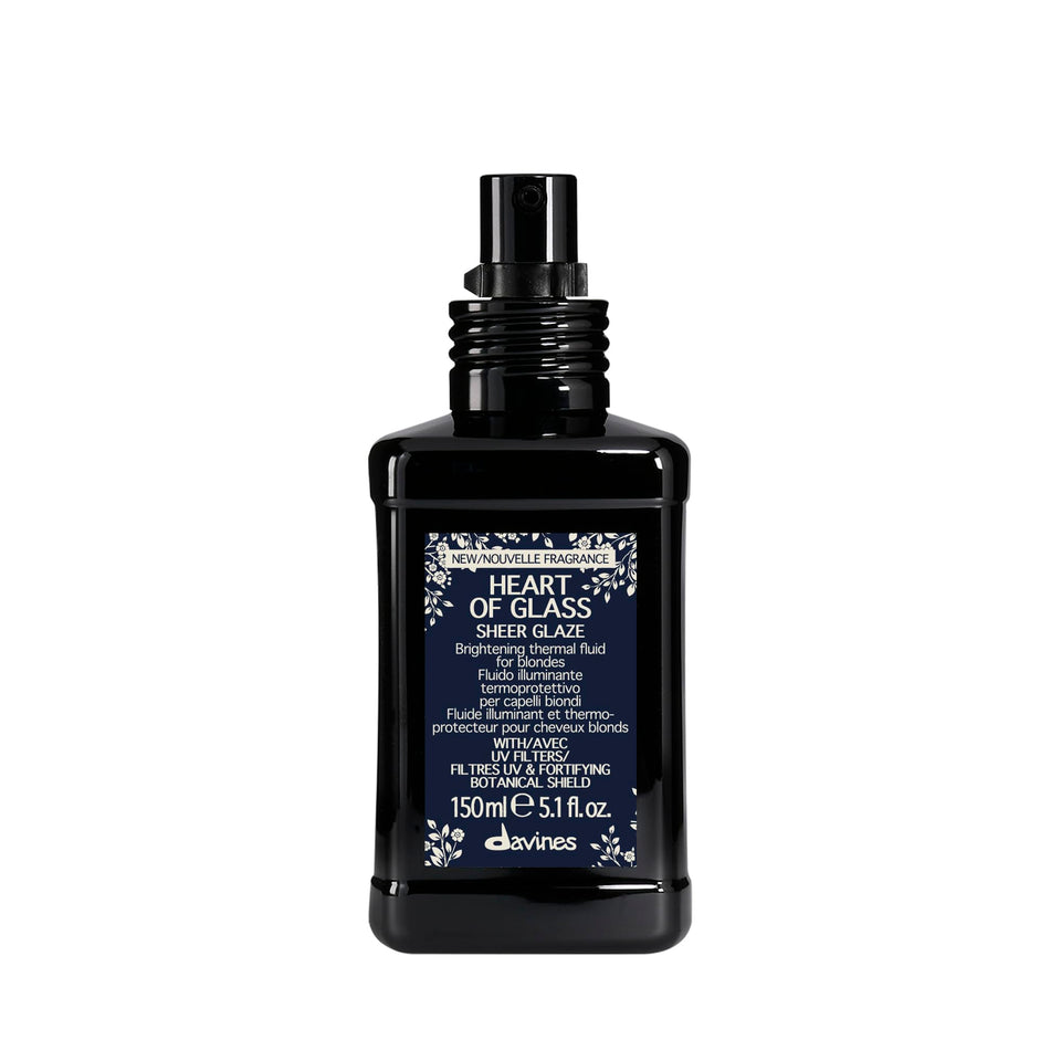 Davines Heart of Glass Sheer Glaze bottle close-up for brightening blondes.