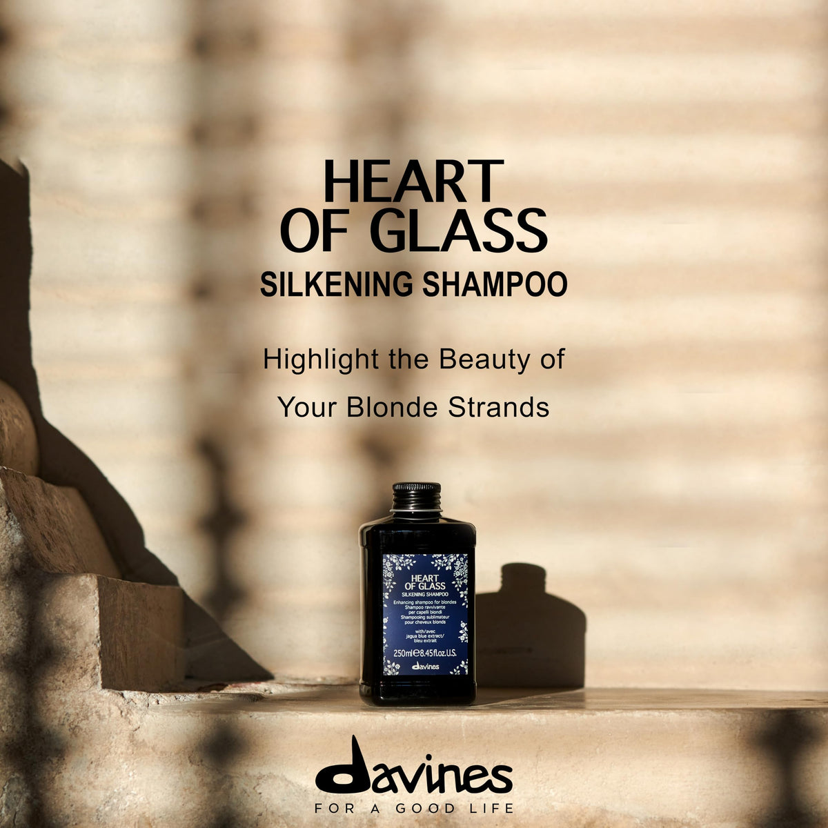 Davines Heart of Glass foam blooming on damp blonde hair.