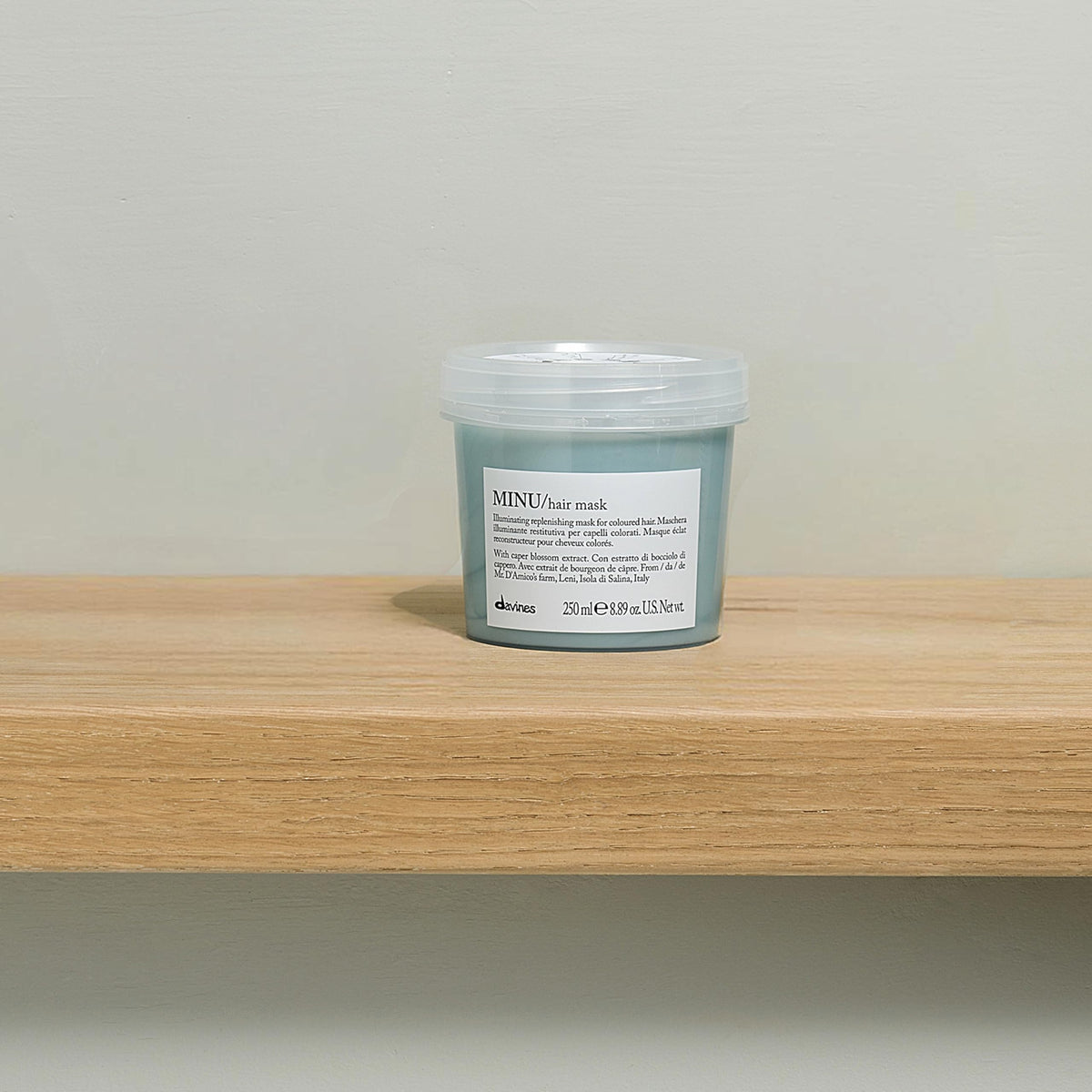Packaging of Davines MINU Hair Mask on a shelf communicates premium care for color-treated locks.