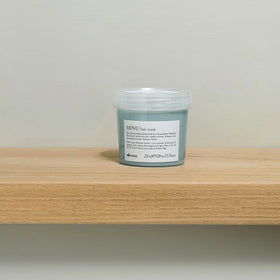 Packaging of Davines MINU Hair Mask on a shelf communicates premium care for color-treated locks.