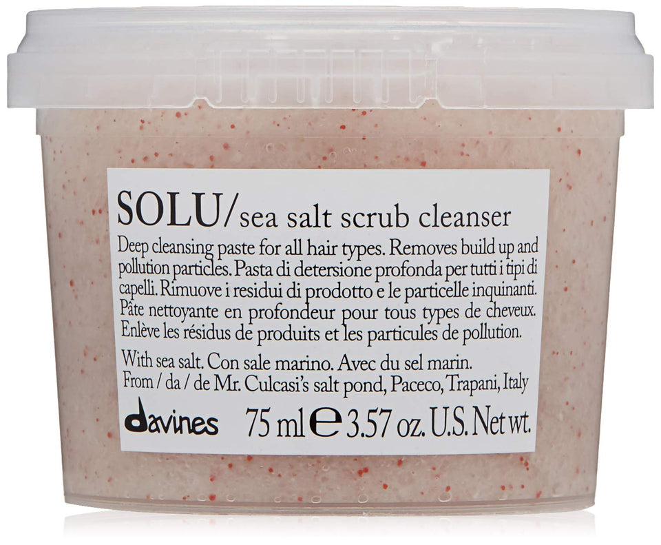 Davines SOLU Sea Salt Scrub bottle pouring cleans scalp