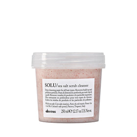 Davines SOLU sea salt scrub bottle for deep scalp cleansing and refreshing results.