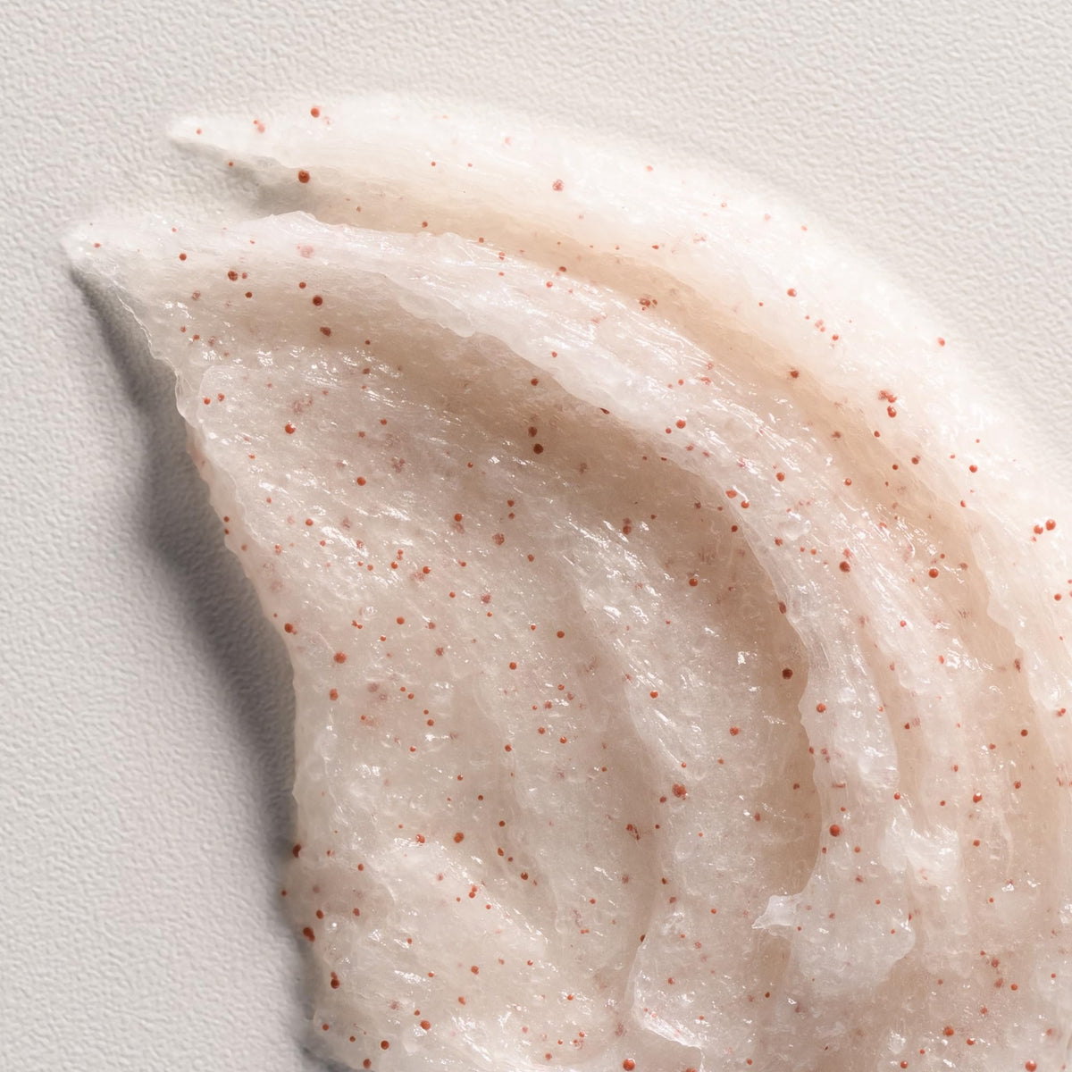 Scrub applied to scalp for cleansing and texture refinement