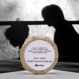 Davines This Is A Shine Wax smoothing flyaways and frizz with shine.