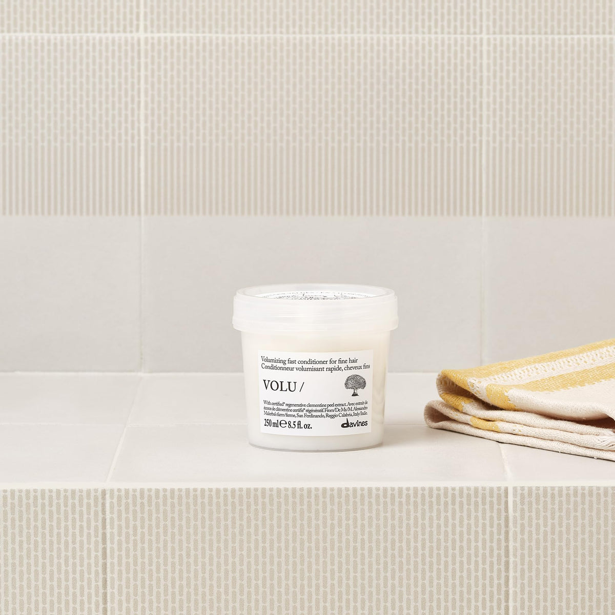 Davines VOLU/Conditioner hair soft silky texture closeup.