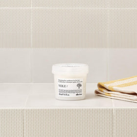 Davines VOLU/Conditioner hair soft silky texture closeup.