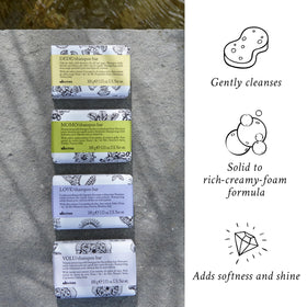 Davines VOLU Shampoo Bar hands creating lather for lift.