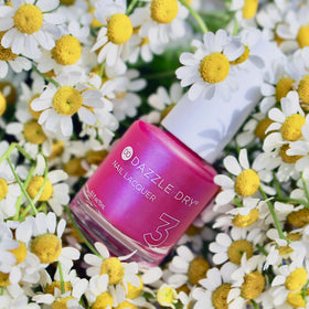 Dazzle Dry Beloved lacquer bottle shows vivid shimmer in natural light.