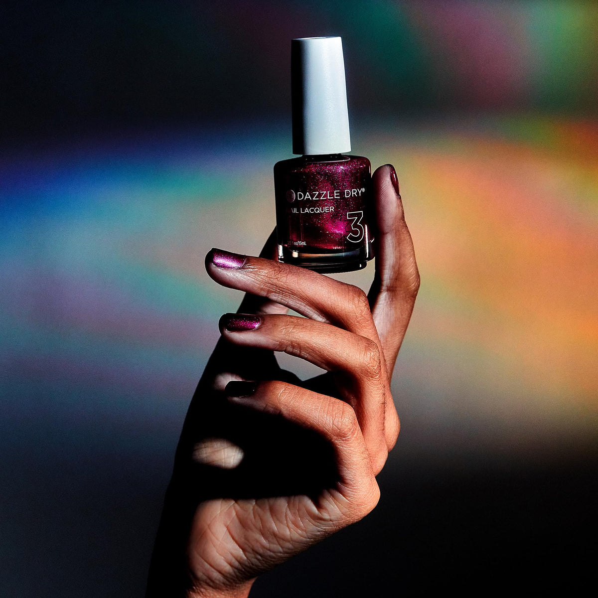 Kaleidoscope on nails with metallic glow and smooth finish