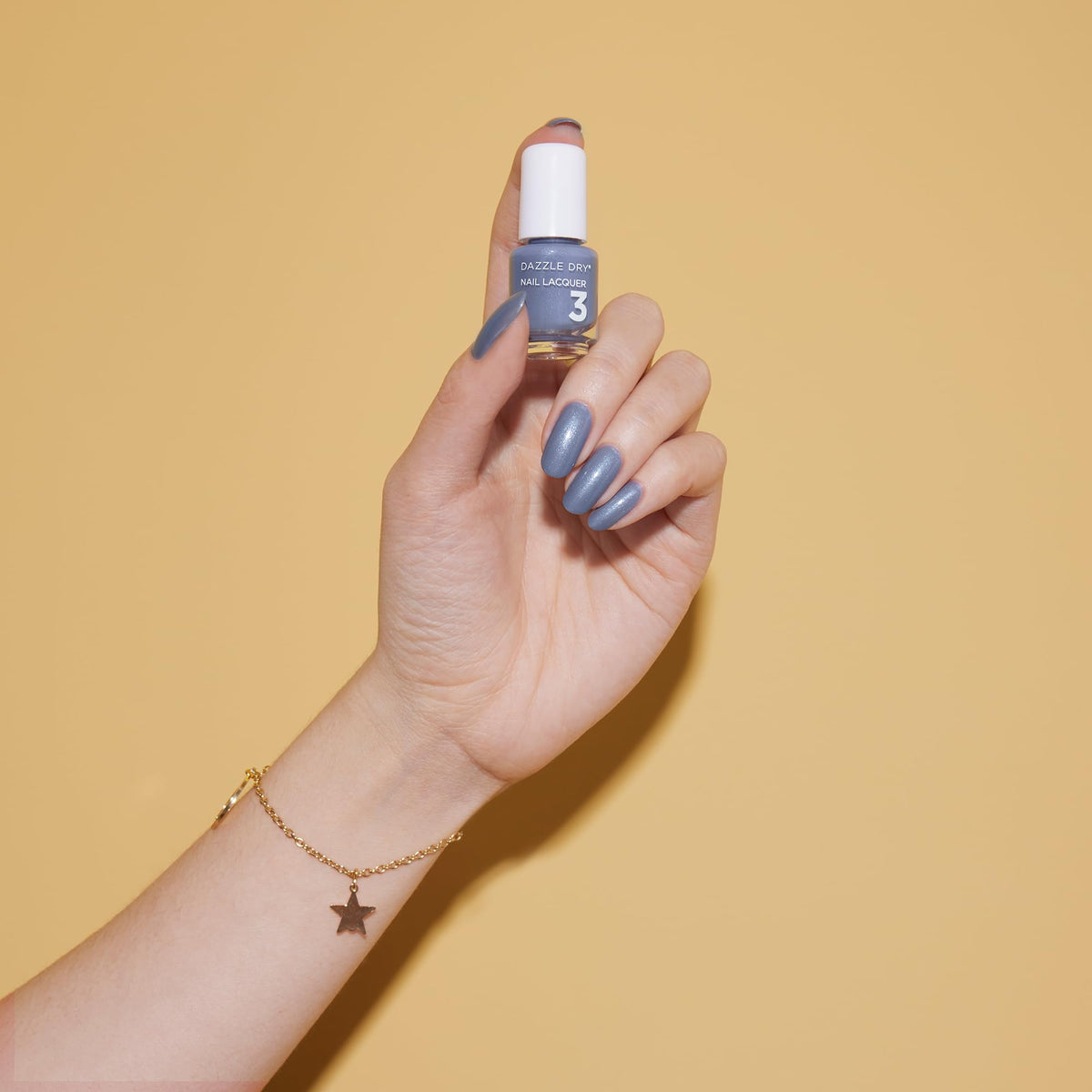 Dazzle Dry lacquer Blue Moon bottle delivers full coverage with shimmer
