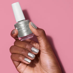 Dazzle Dry metallic-silver finish on nails demonstrates bold, reflective glamour.