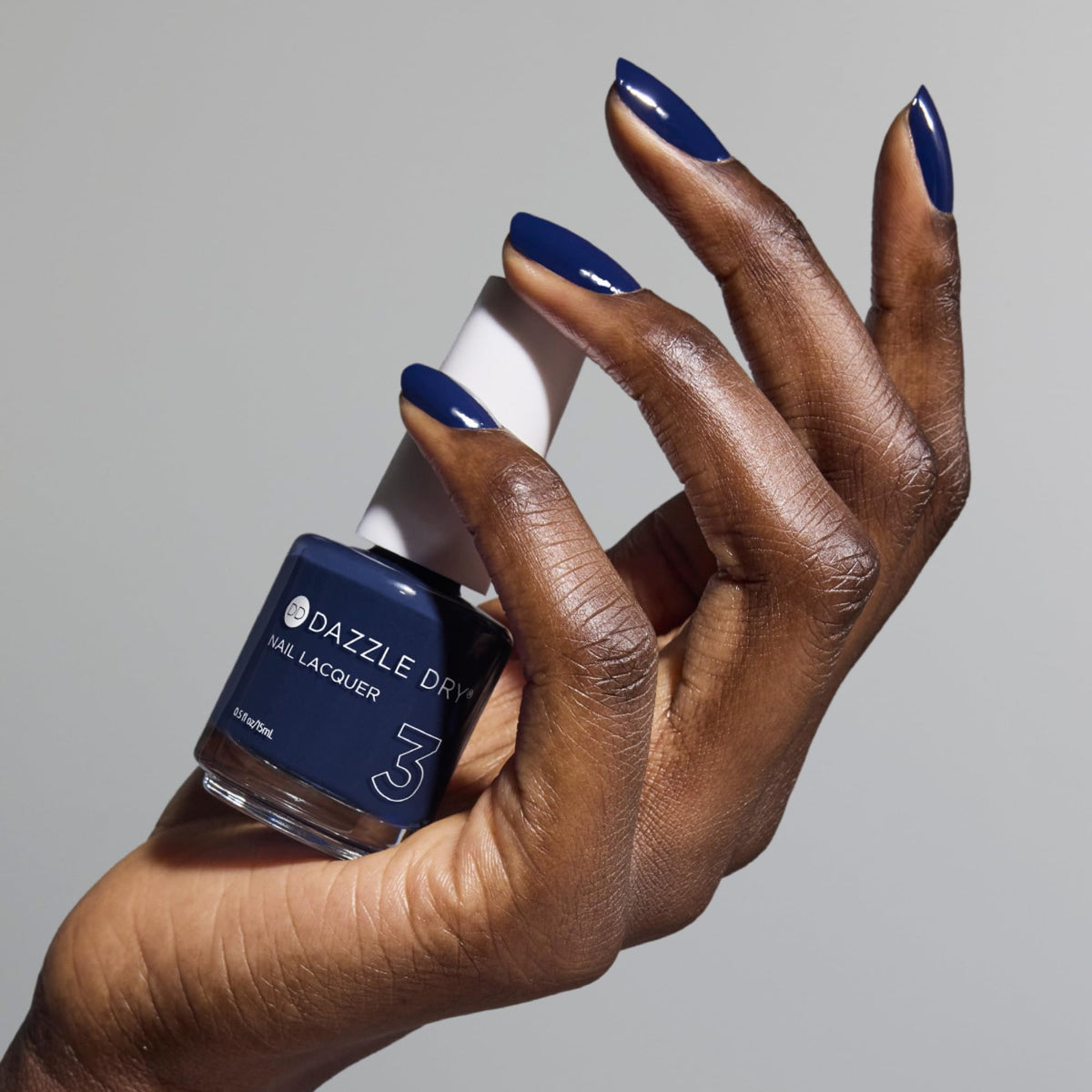 Dazzle Dry Midnight Sky top coat application seals for lasting shine.