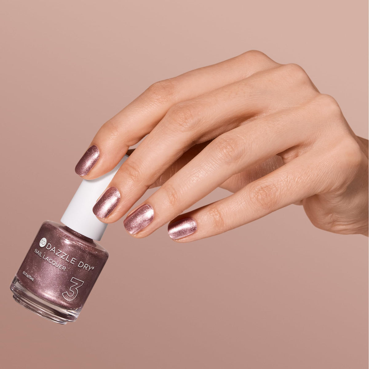 Rose gold reflection on the bottle suggests salon-quality home results.