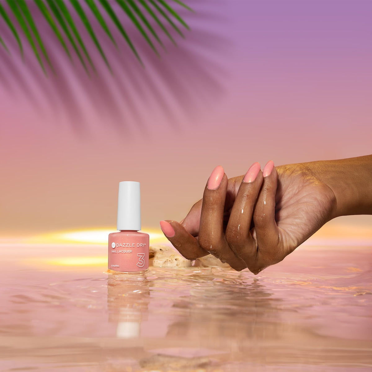 Dazzle Dry Sunset Glow swatches on nail; subtle shimmer enhances color.