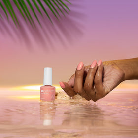 Dazzle Dry Sunset Glow swatches on nail; subtle shimmer enhances color.