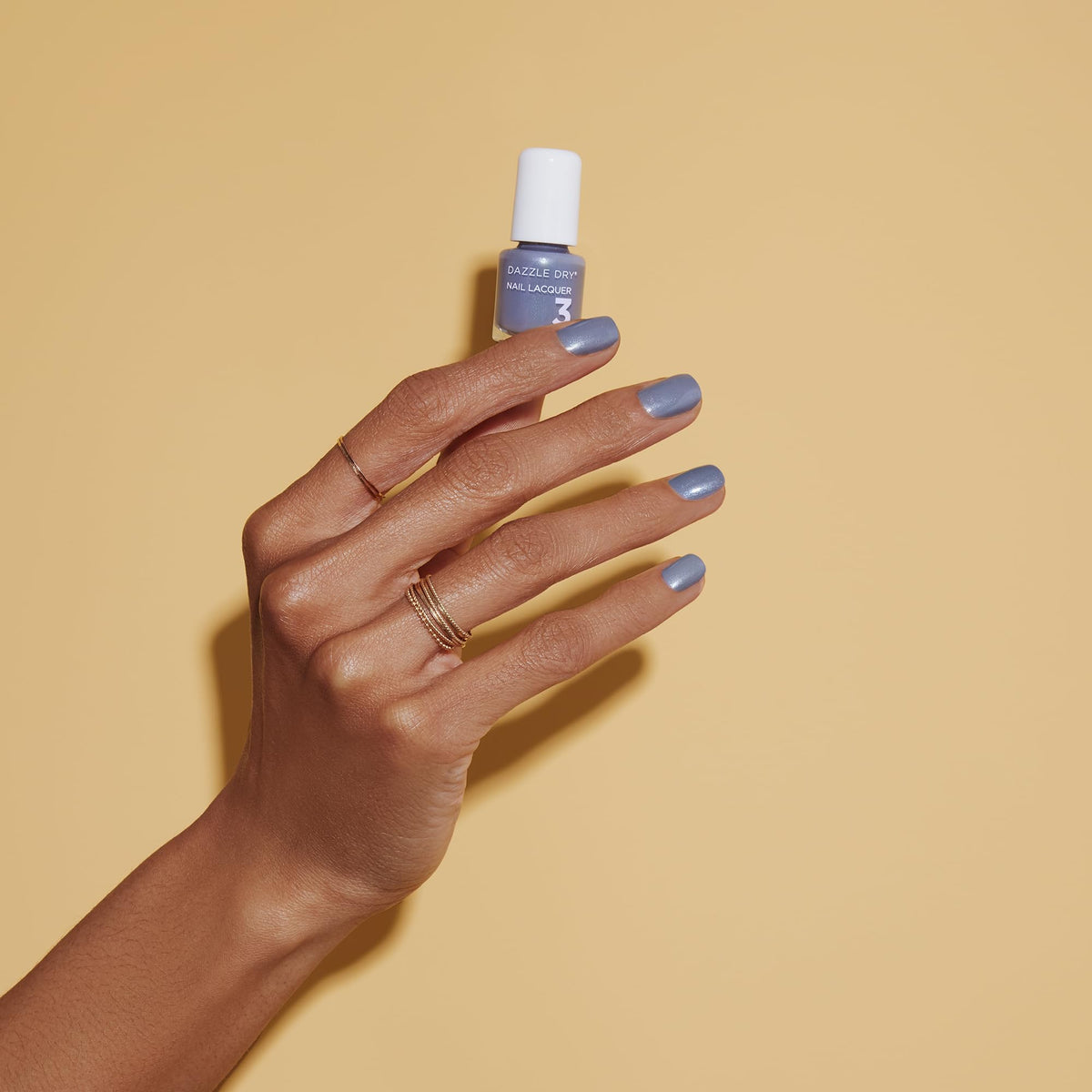 Dazzle Dry top coat bottle provides chip resistant glossy shine
