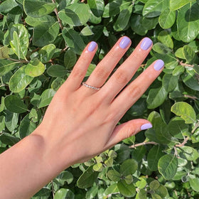 Dazzle Dry base coat being applied to nails for lasting wear