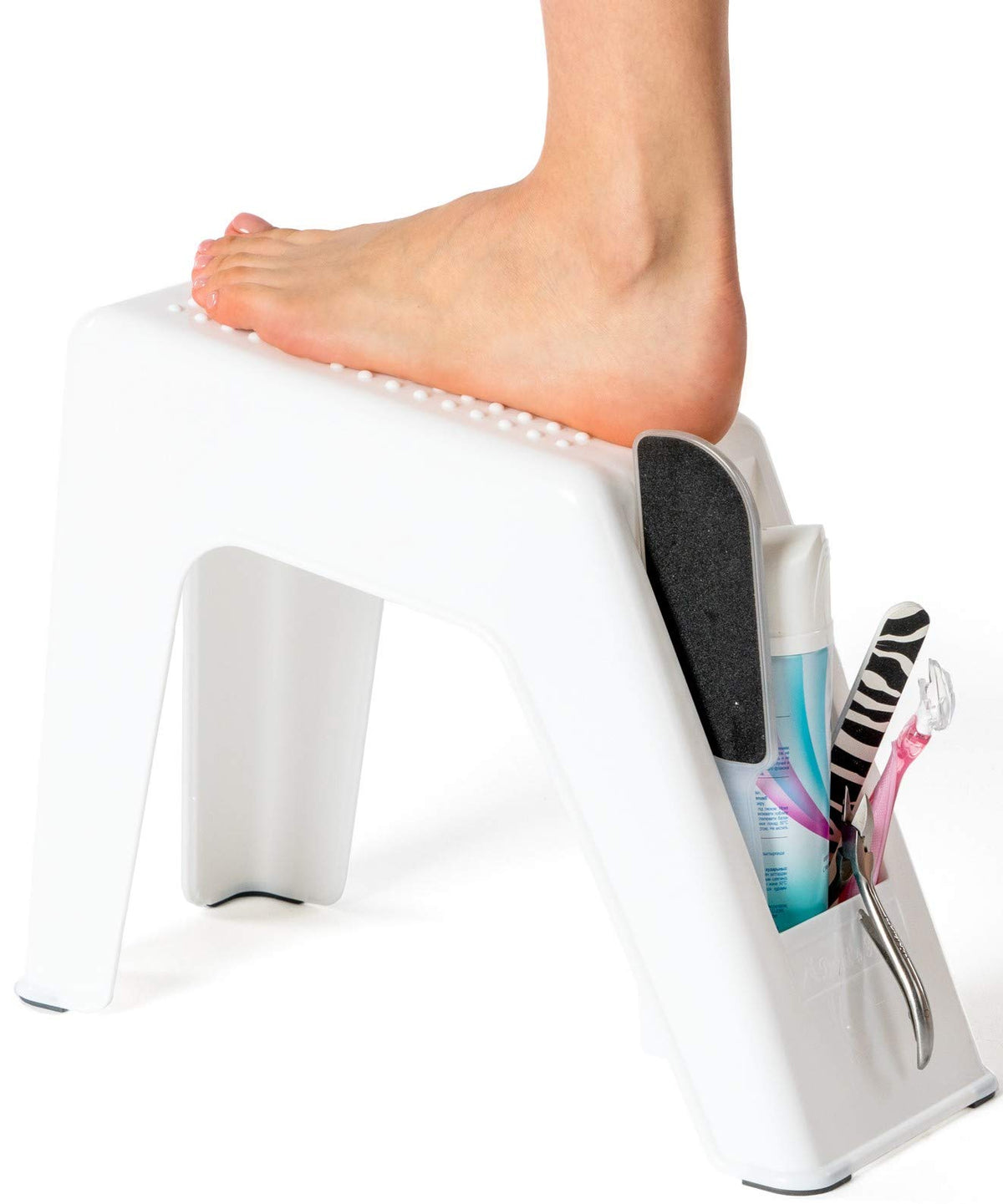 Demi's Home white shower foot rest with front compartment for shaving supplies.