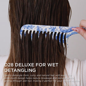 Denman D28 detangler used on dry hair to define curls and reduce frizz.