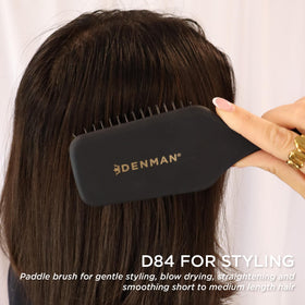 Denman D84 detangling during a blow-dry session for rapid drying and smoothing.