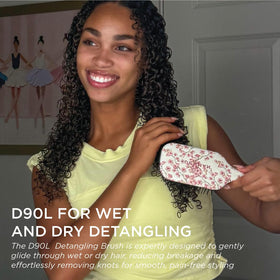 Denman ergonomic-handle detangler offers comfortable grip during styling.