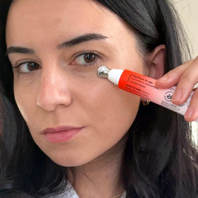 Derma E cooling metal tip applying cream under the eye
