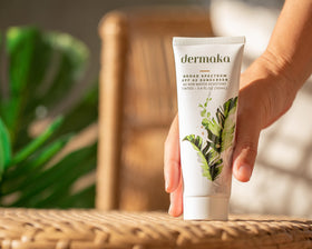 Dermaka aloe-based sunscreen being applied for hydration and gentle coverage.
