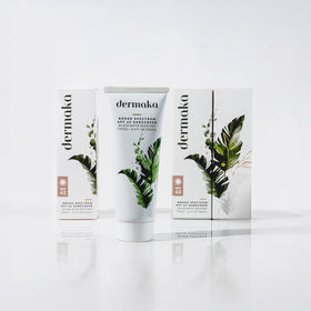 Dermaka SPF 42 mineral sunscreen bottle demonstrating water resistance use.