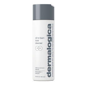 Dermalogica Oil To Foam Total Cleanser bottle on bathroom counter for makeup removal.