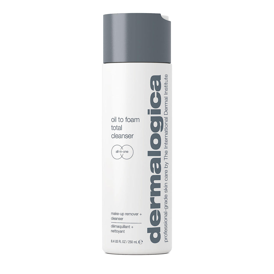 Dermalogica Oil To Foam Total Cleanser bottle on bathroom counter for makeup removal.