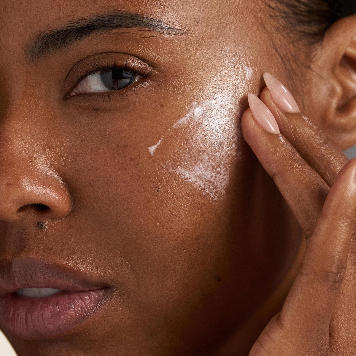 Apply Prisma Protect on the face for moisture and UV defense.