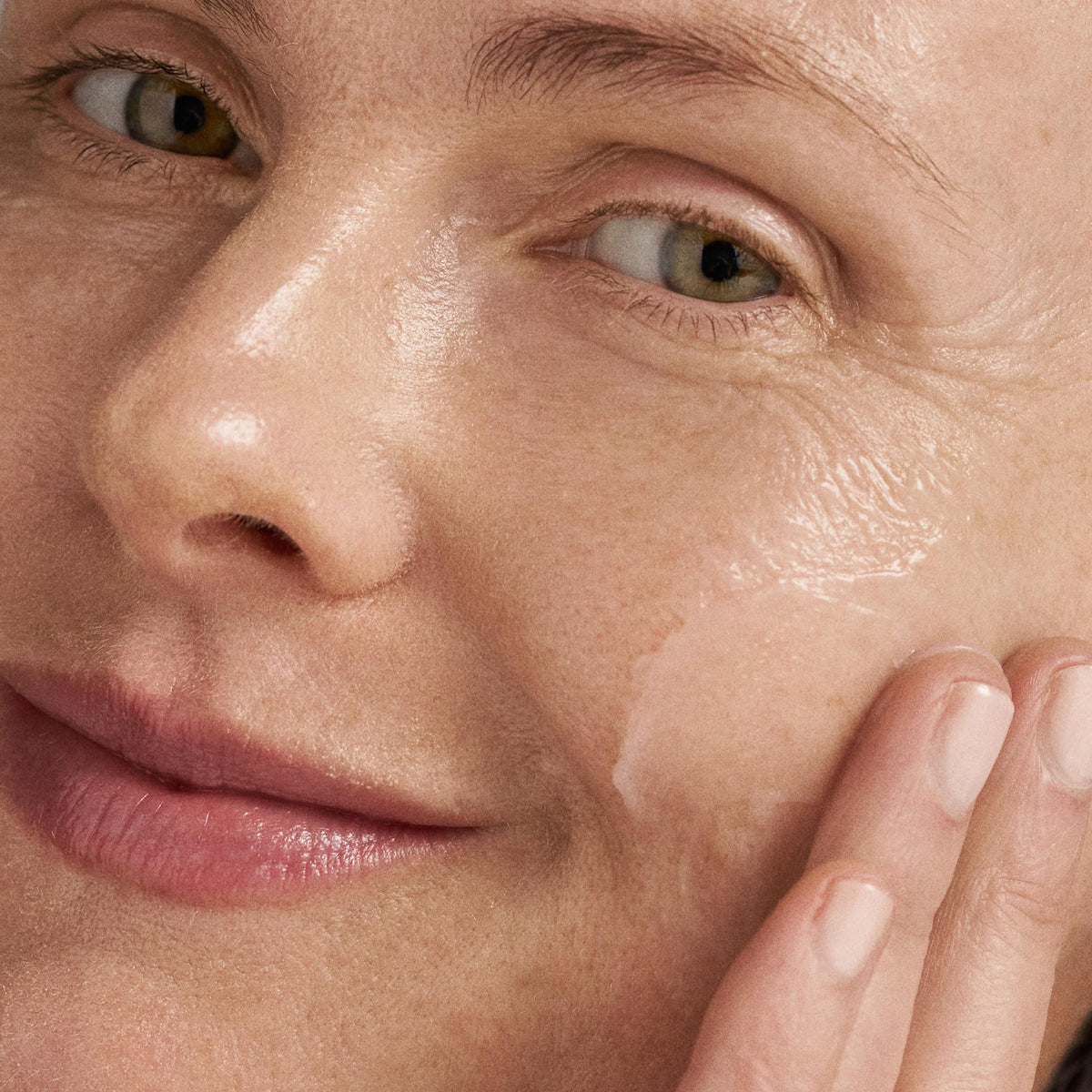 Cool water droplets near face after cleansing showing refreshing feel