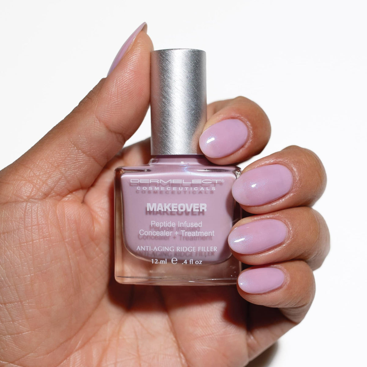 Dermelect Makeover Lilac brush applying even ridge-filling formula.