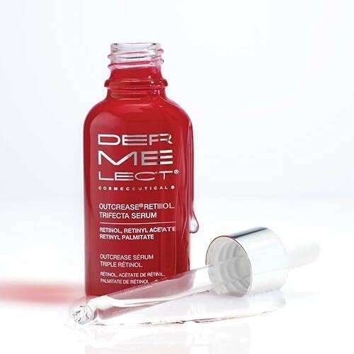 Dermelect Outcrease bottle on skin demonstrates hydration and brightening potential.