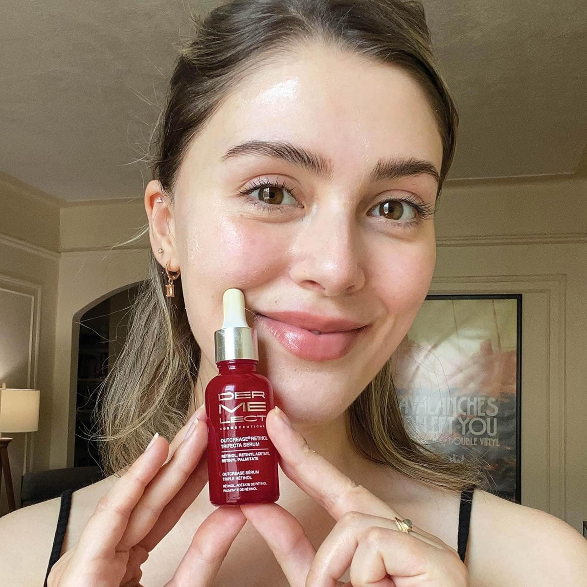 Dermelect Outcrease serum texture closeup reveals smooth, creamy consistency.