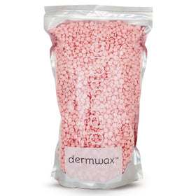 Dermwax Pink Chiffon hard wax beads in a jar, smooth texture for controlled Brazilian waxing.
