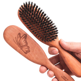 Desert Breeze Calcutta boar bristle brush front view showing bristles and design for oil distribution