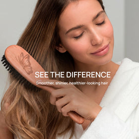 Tibet brush used on fine hair to reduce tangles with soft bristles.