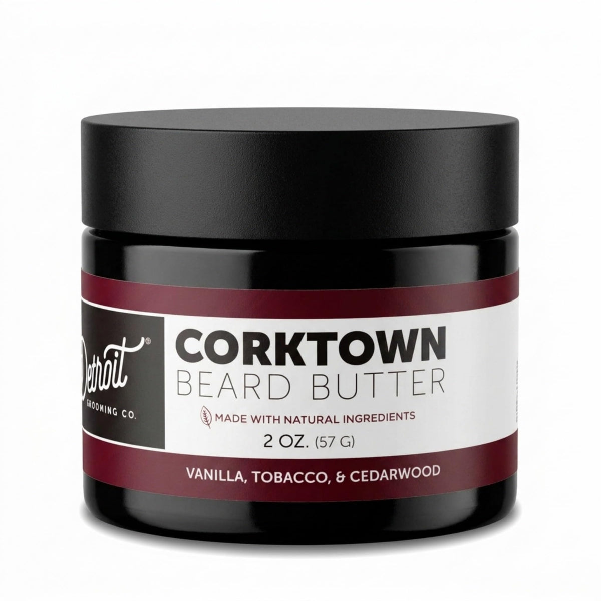 Detroit Grooming Co. Beard Butter bottle close-up showing 2oz size and premium conditioning.