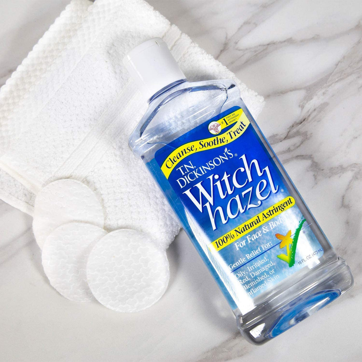 Dickinson's Witch Hazel 8 oz bottle pouring to help control oil and pores.
