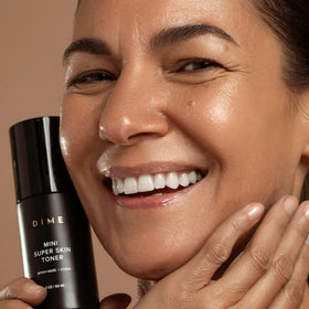 DIME Beauty Mini Super Skin Toner compact travel routine in a carry-on setup.